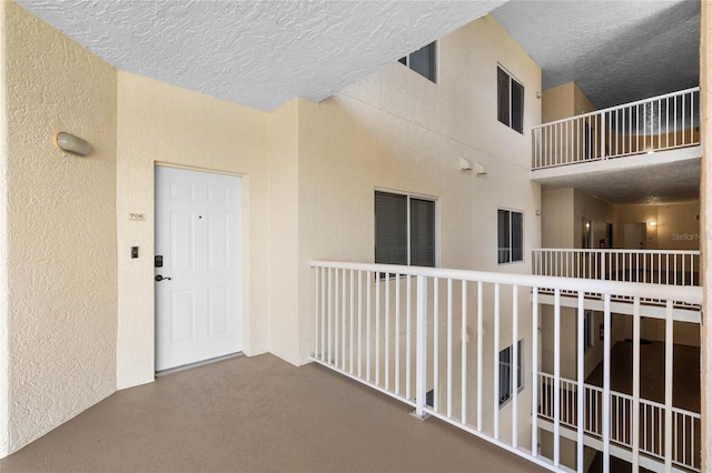 entrance to property with a balcony