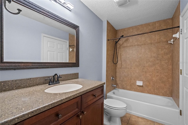 full bath with shower / bathtub combination, toilet, vanity, a textured ceiling, and tile patterned flooring