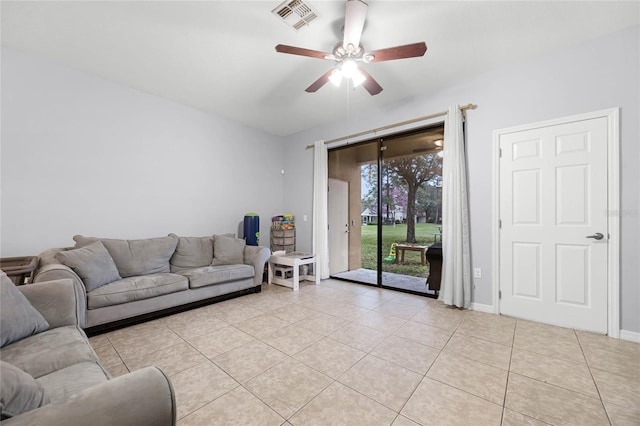 living room with light tile patterned floors, baseboards, visible vents, and a ceiling fan