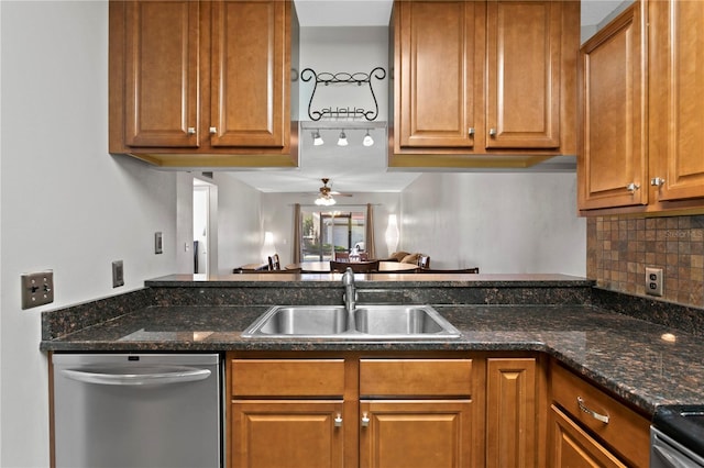 kitchen featuring a ceiling fan, brown cabinetry, a sink, and stainless steel dishwasher