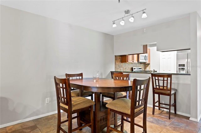 dining room featuring baseboards