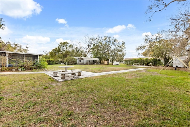 view of yard featuring a sunroom