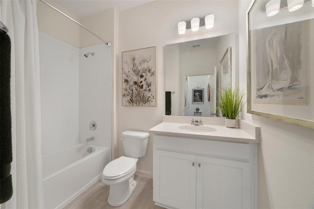 bathroom featuring washtub / shower combination, visible vents, vanity, and toilet