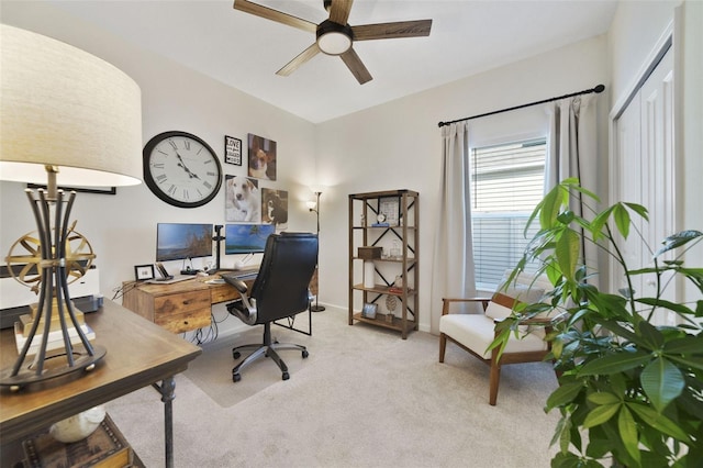 office with light carpet, ceiling fan, and baseboards