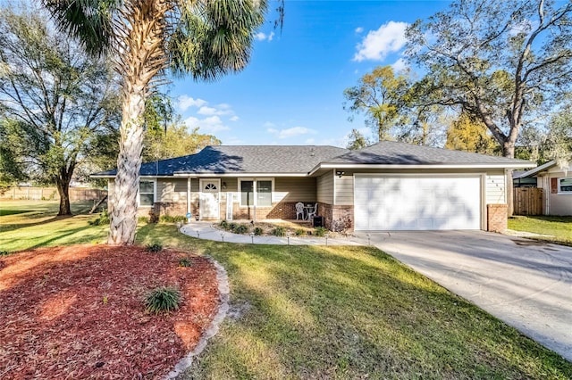 ranch-style house with brick siding, an attached garage, fence, and a front yard