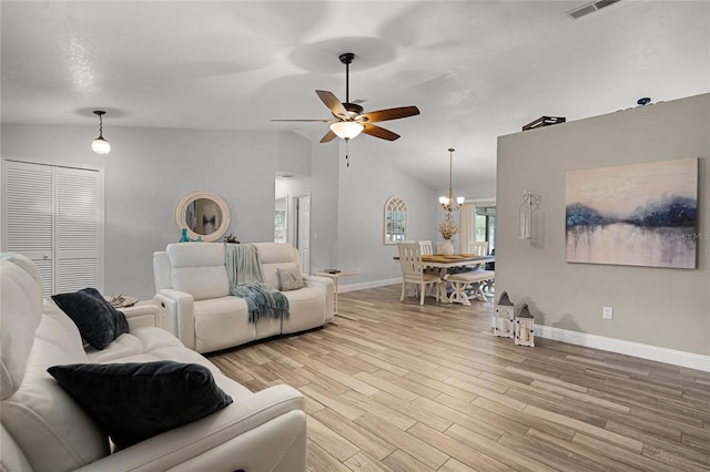 living room with light wood finished floors, visible vents, vaulted ceiling, baseboards, and ceiling fan with notable chandelier