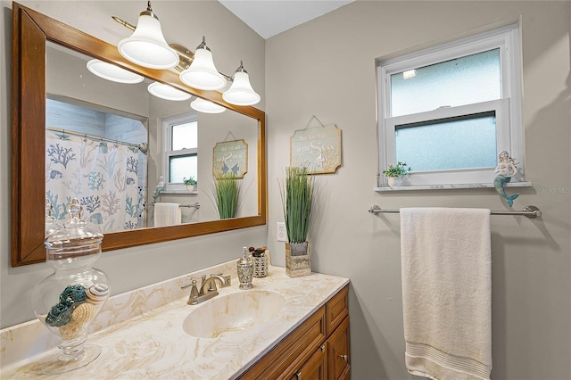 bathroom featuring a shower with curtain and vanity