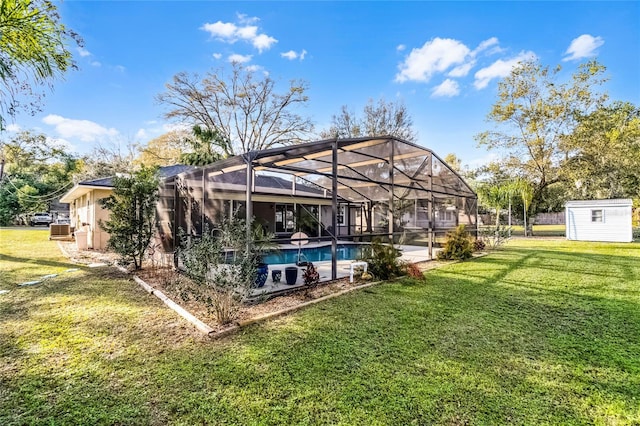 exterior space with a storage shed, an outdoor pool, glass enclosure, an outbuilding, and a patio area