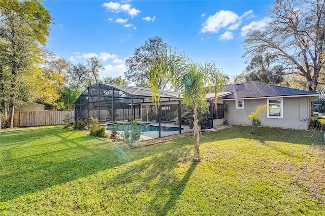 exterior space with glass enclosure, fence, and a fenced in pool