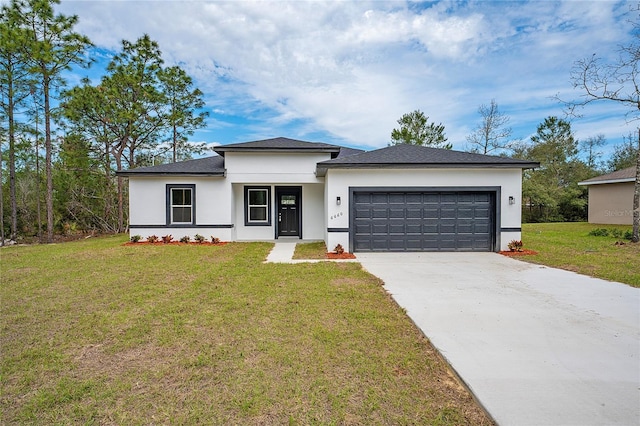 view of front of property with stucco siding, an attached garage, driveway, and a front lawn