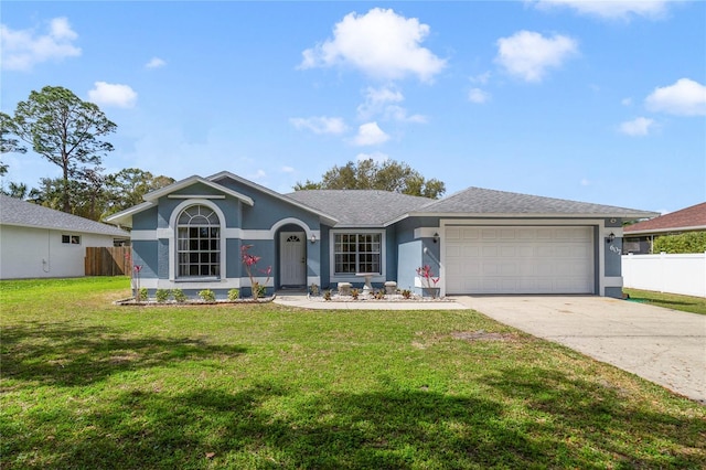 single story home with a garage, fence, driveway, and stucco siding