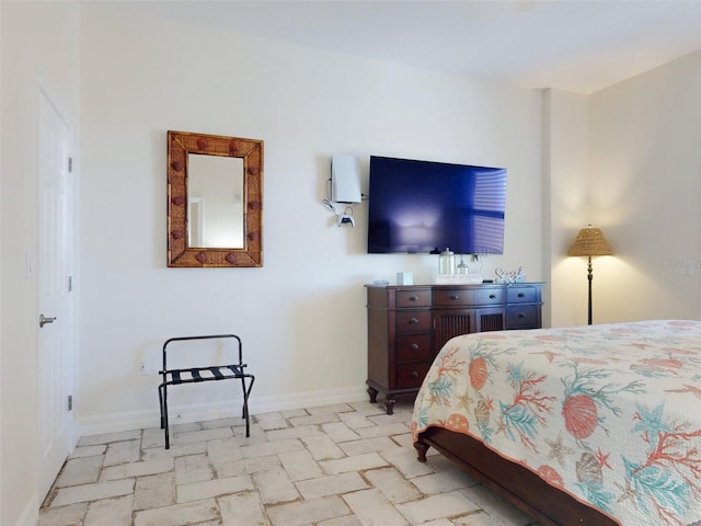 bedroom featuring baseboards