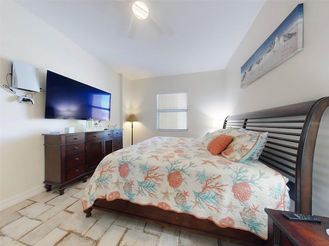 bedroom featuring a ceiling fan and baseboards