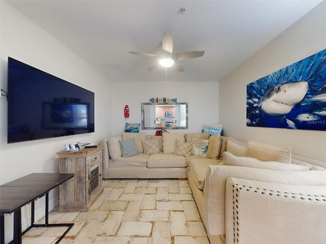 living area featuring ceiling fan