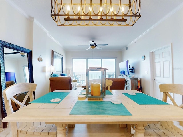 dining room featuring a ceiling fan and crown molding