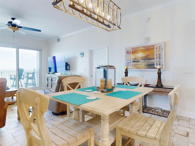 dining space with crown molding, stone tile floors, visible vents, baseboards, and ceiling fan with notable chandelier