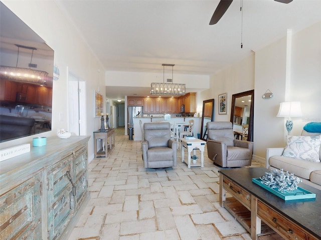 living area with brick floor and a ceiling fan