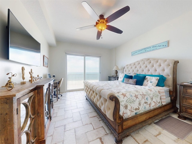 bedroom with access to exterior and a ceiling fan