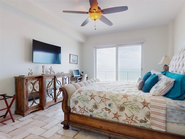 bedroom with access to exterior and a ceiling fan