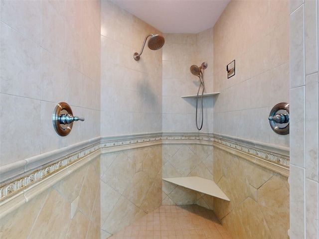 full bath with tiled shower