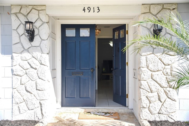 entrance to property with stone siding