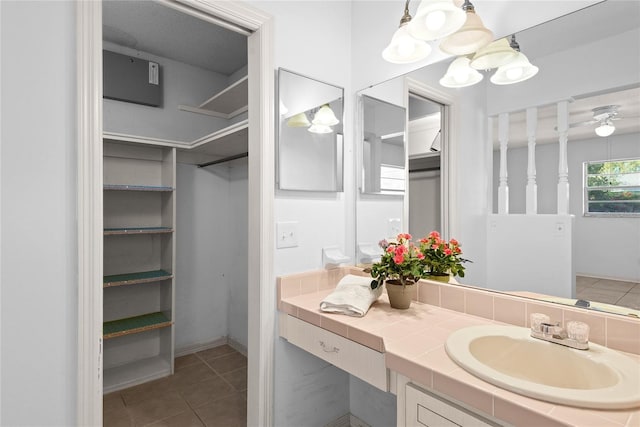 bathroom featuring tile patterned flooring and vanity