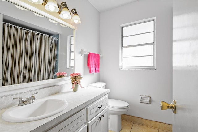 full bath featuring toilet, curtained shower, tile patterned flooring, and vanity