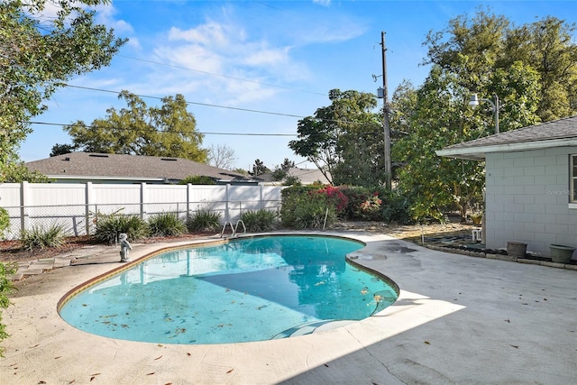 view of pool with fence, a fenced in pool, and a patio