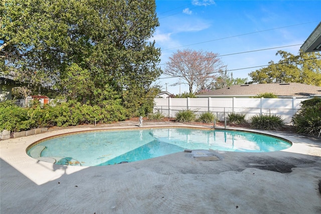 view of pool featuring a fenced in pool, fence, and a patio