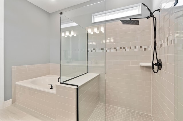 full bath featuring tiled shower and a bath