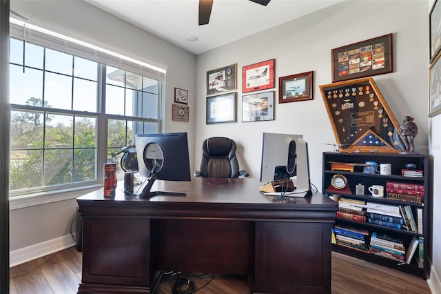 office space with baseboards, a ceiling fan, and wood finished floors