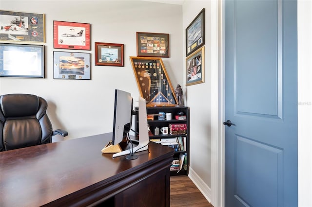 office area featuring baseboards and dark wood finished floors