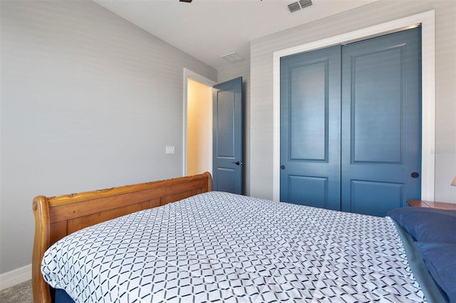 bedroom featuring a closet and visible vents