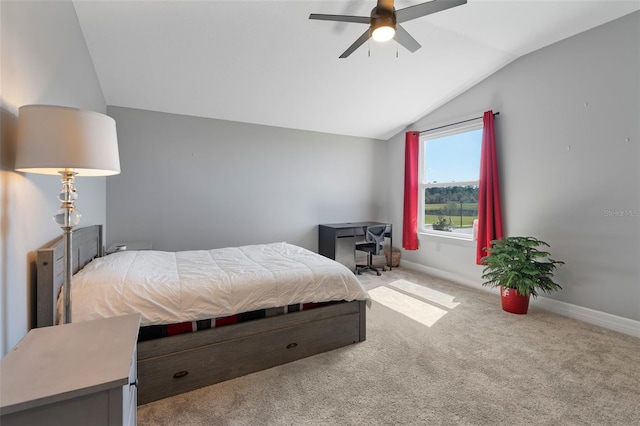 bedroom with carpet floors, lofted ceiling, ceiling fan, and baseboards