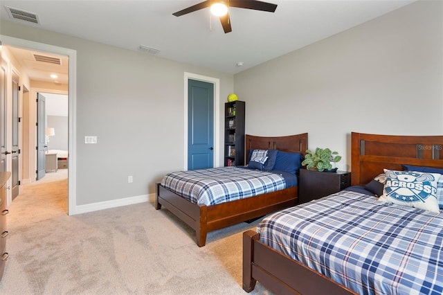 bedroom with attic access, light carpet, visible vents, and baseboards