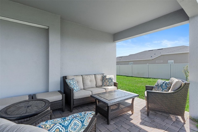 view of patio / terrace with fence and an outdoor hangout area