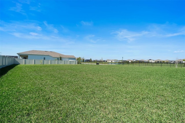 view of yard featuring fence