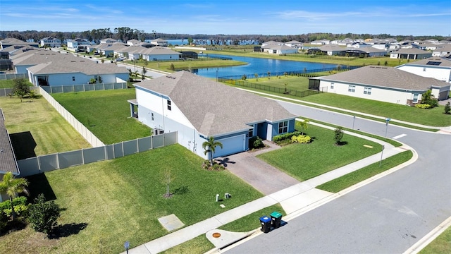 bird's eye view with a water view and a residential view