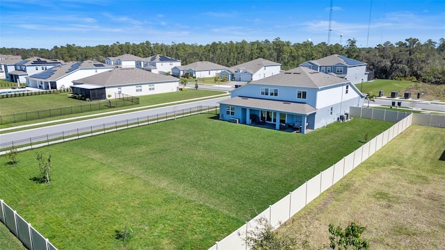 birds eye view of property with a residential view