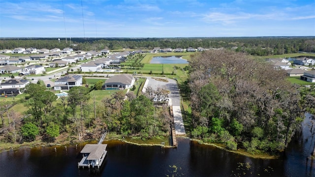 bird's eye view with a residential view and a water view