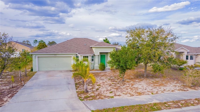 view of front facade featuring an attached garage, roof with shingles, concrete driveway, and stucco siding