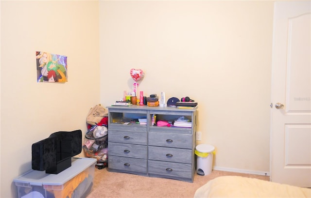 carpeted bedroom featuring baseboards