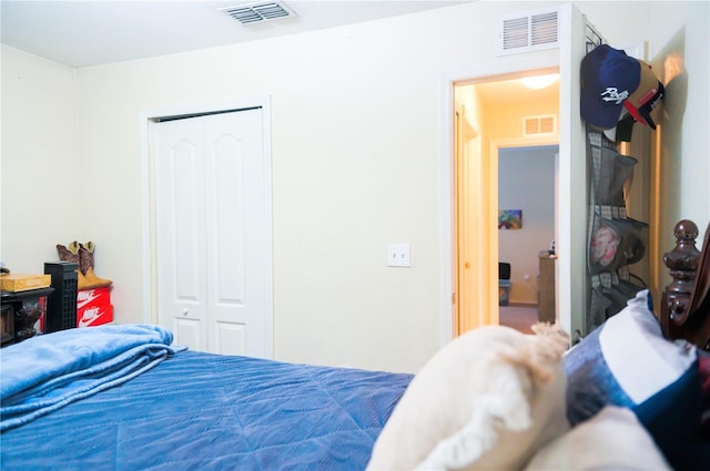 bedroom featuring a closet and visible vents