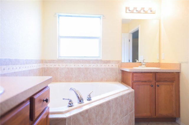 full bath featuring tile patterned floors, a bath, and vanity