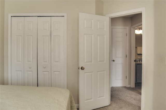 carpeted bedroom featuring a closet