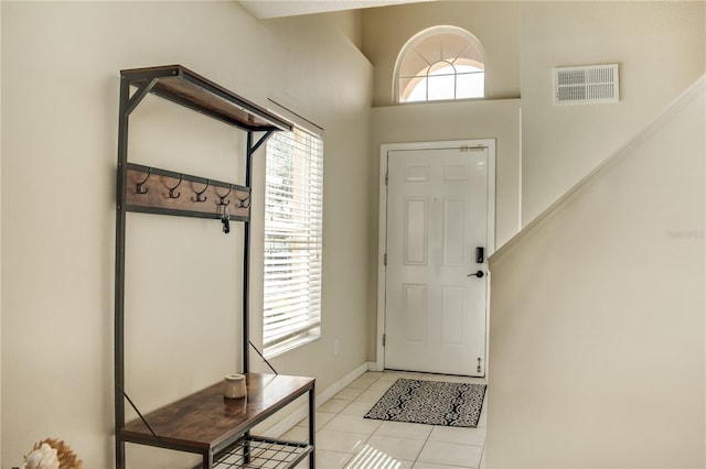 entryway featuring visible vents, baseboards, and light tile patterned flooring