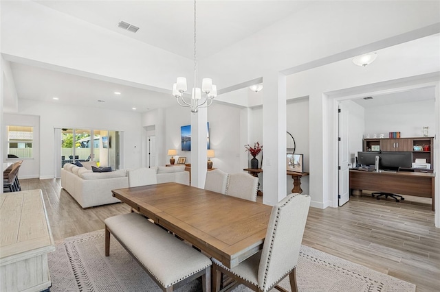 dining area featuring light wood finished floors, baseboards, visible vents, an inviting chandelier, and recessed lighting