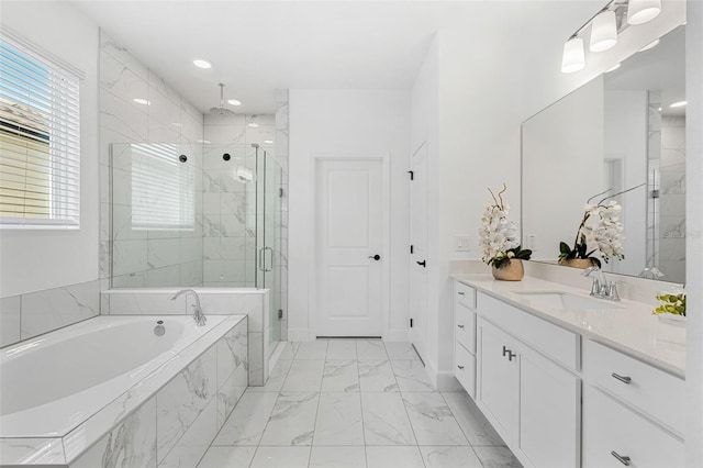 full bath featuring a shower stall, a garden tub, plenty of natural light, vanity, and marble finish floor