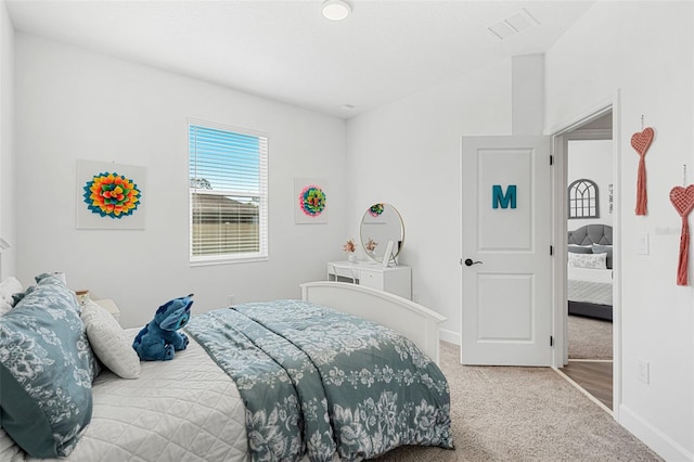 carpeted bedroom with baseboards