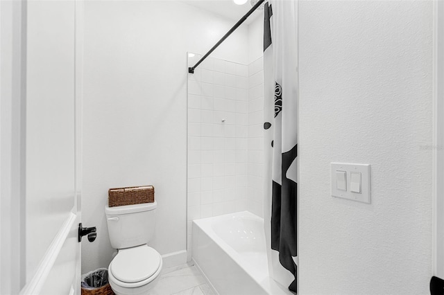 full bathroom featuring shower / bath combo, marble finish floor, toilet, and baseboards